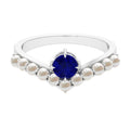 0.9 Carat Solitaire Blue Sapphire and Freshwater Pearl Chevron Ring